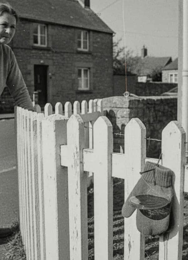 Bell-bottoms by the Fence — photograph by Henri de Bruyn — MODULAR · 13 × 18 cm limited edition of 10