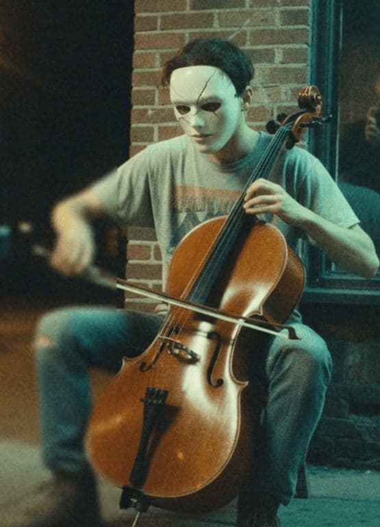 Cello Player City Night — photograph by Elena Volkova — MODULAR · 13 × 18 cm limited edition of 10