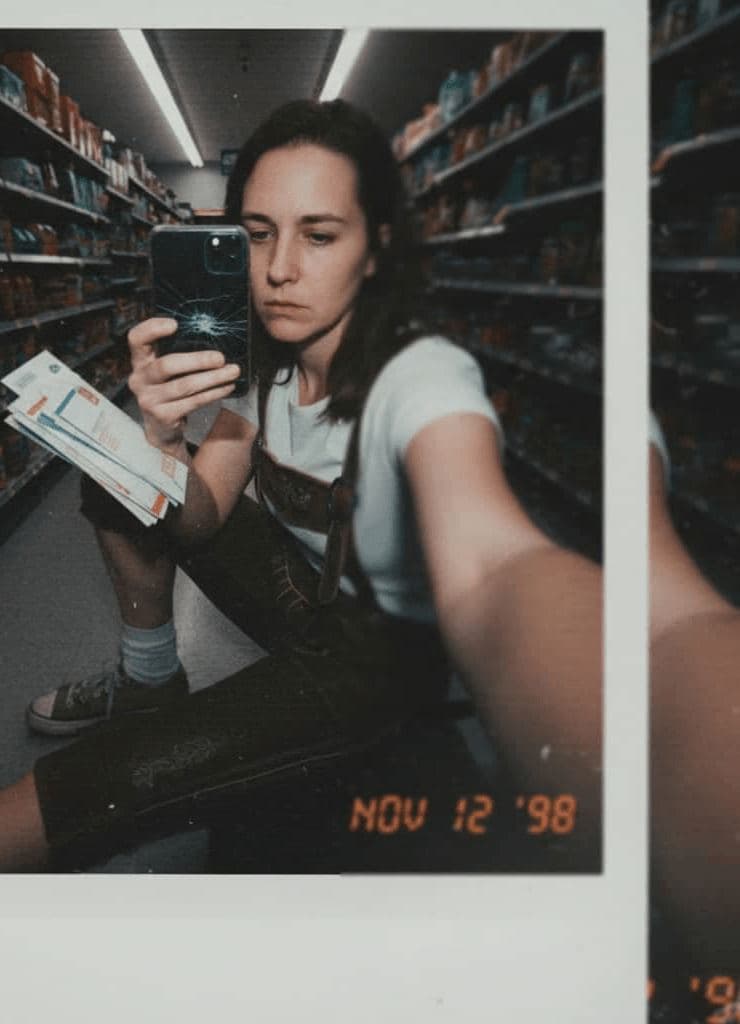 a woman in head-to-toe lederhosen with sneakers, scrolling t — Nadia Vorholt · MODULAR one-of-a-kind original